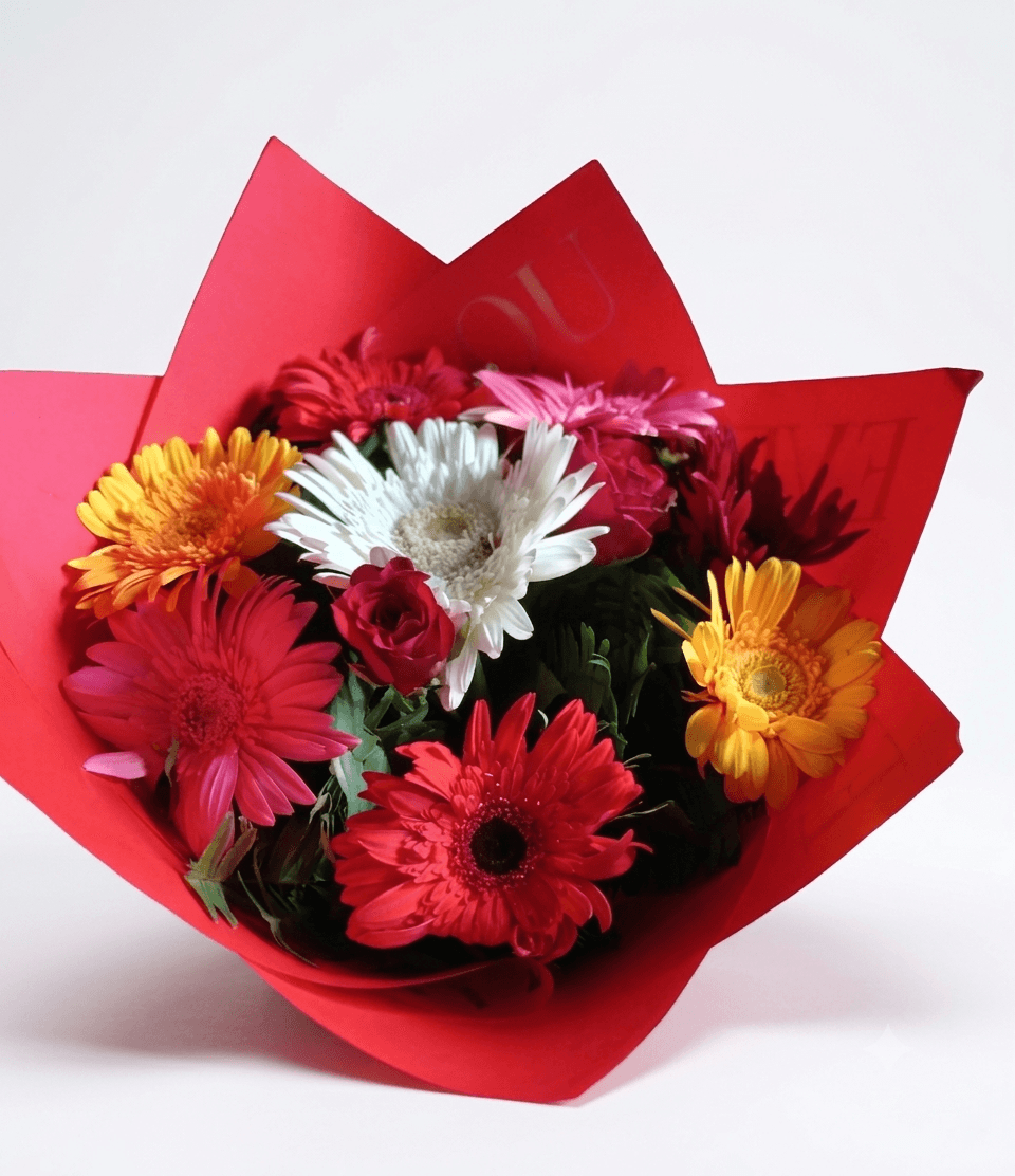 Mix gerbera with roses and red paper — fresh bouquet delivery near TIA, Kathmandu